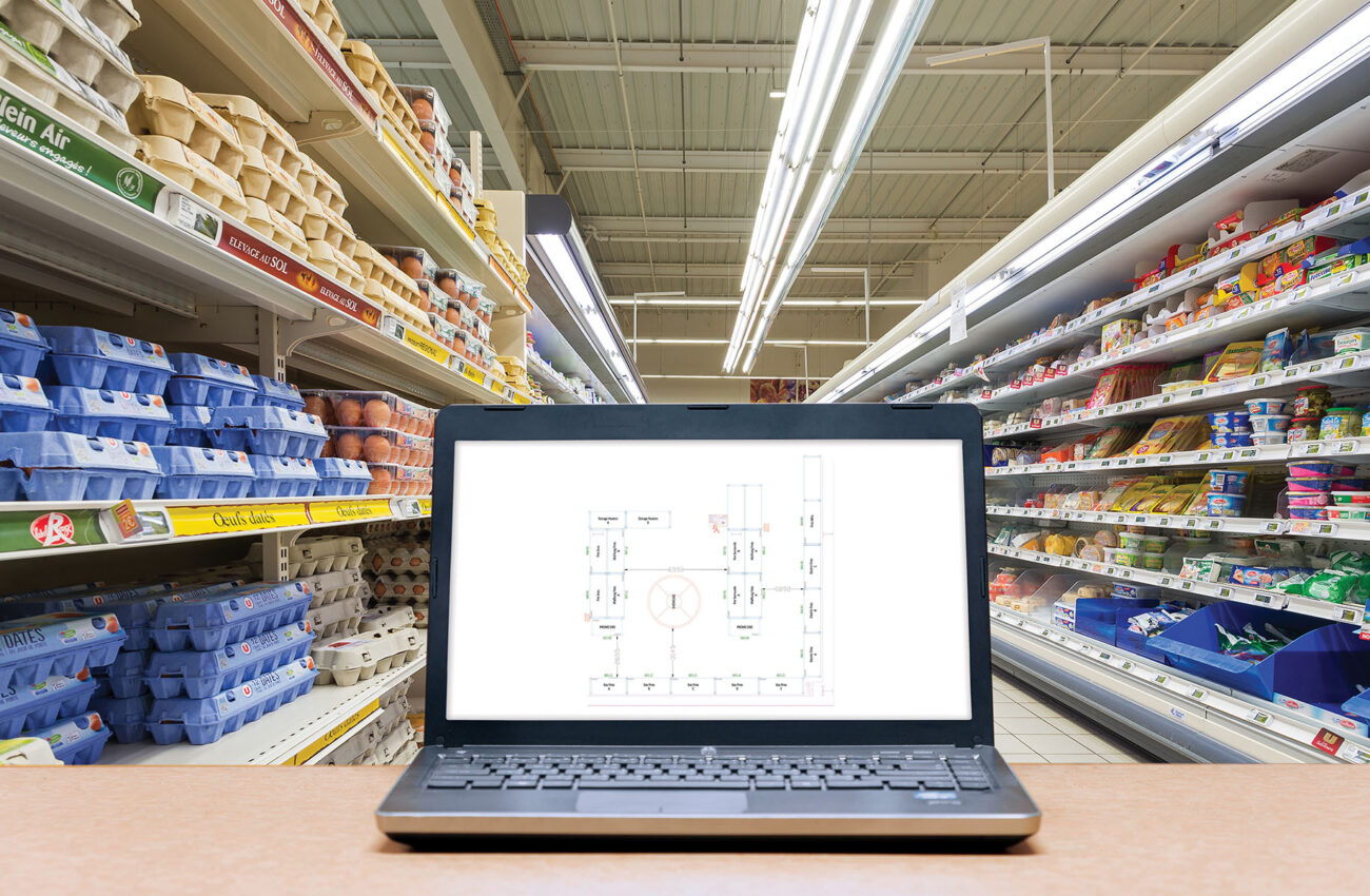 Laptop with analysis sale screen on table with blur warehouse ca