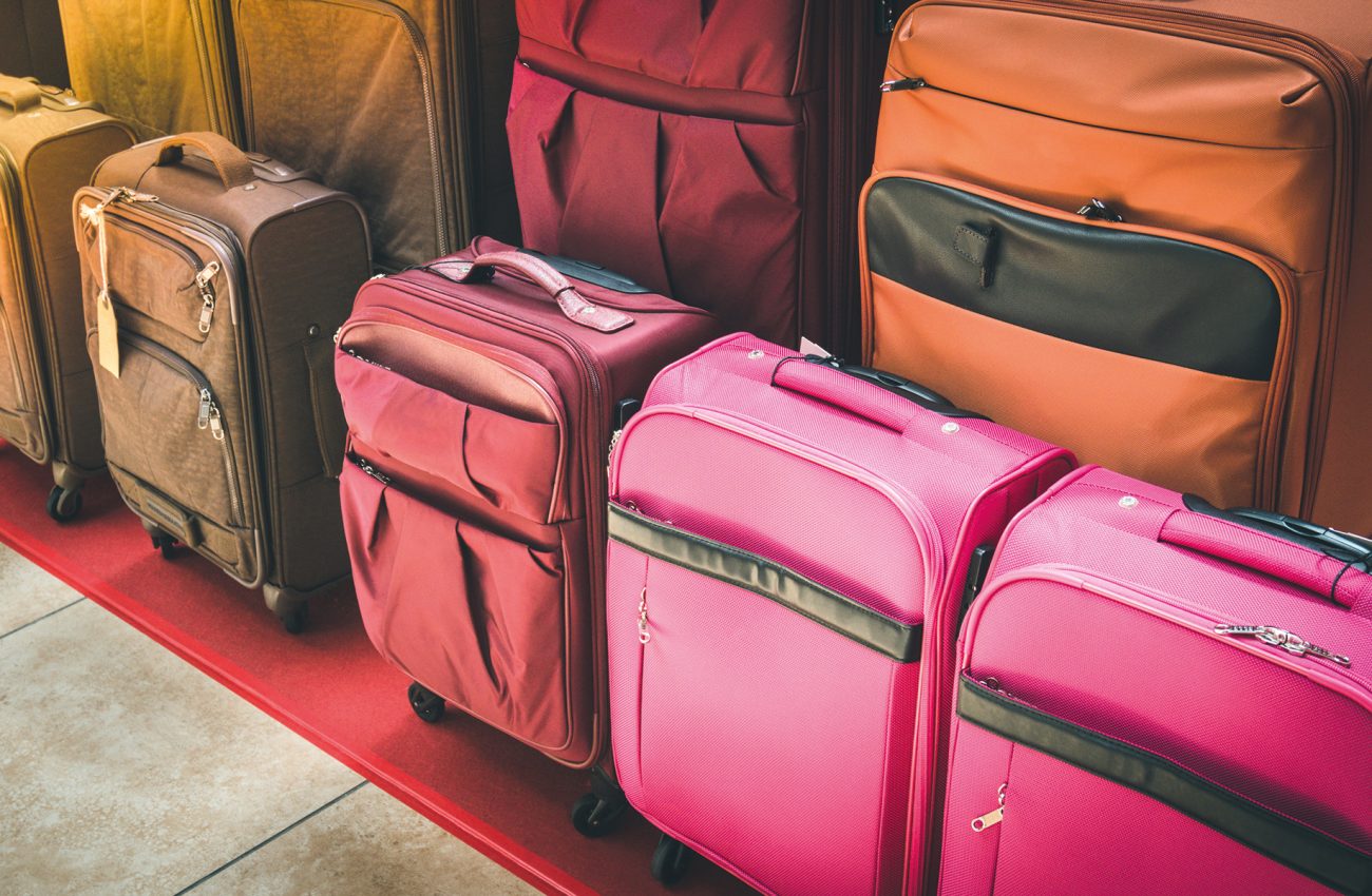 Luggage consisting of large suitcases rucksacks and travel bag.